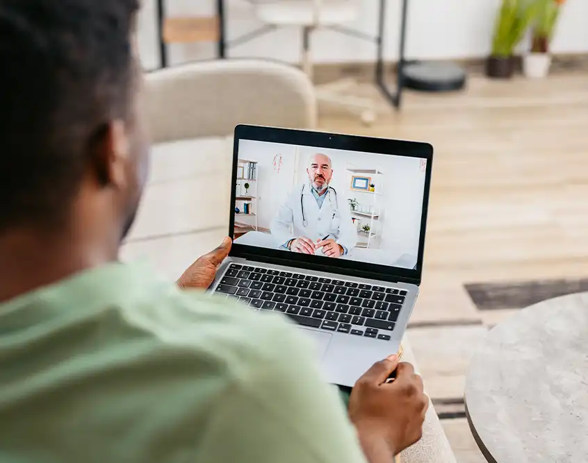 Woman on a video visit with a doctor from home