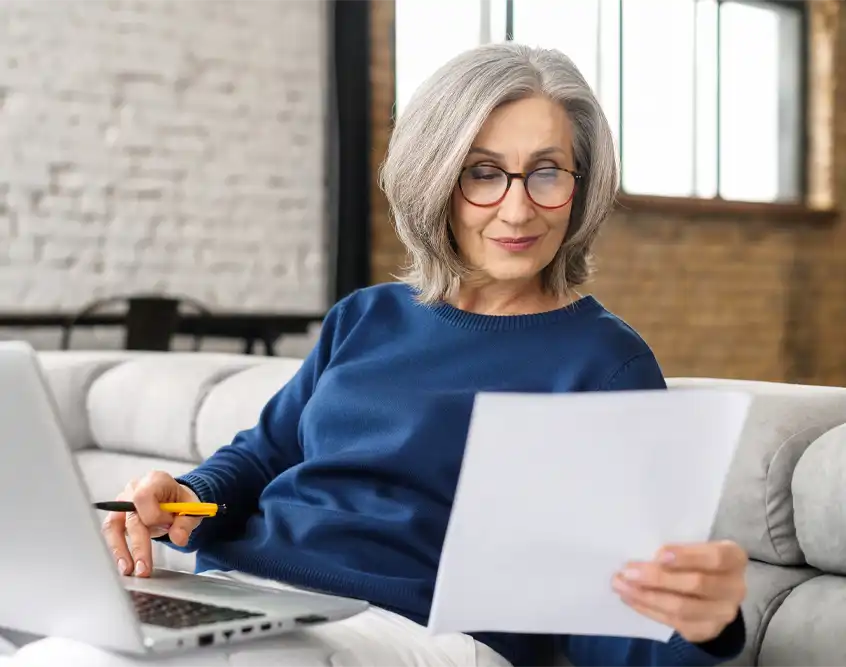Person reviewing an Explanation of Benefits statement at home