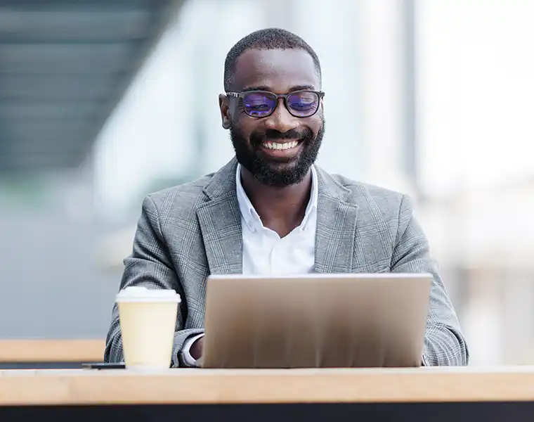 Young adult working on a laptop at the office